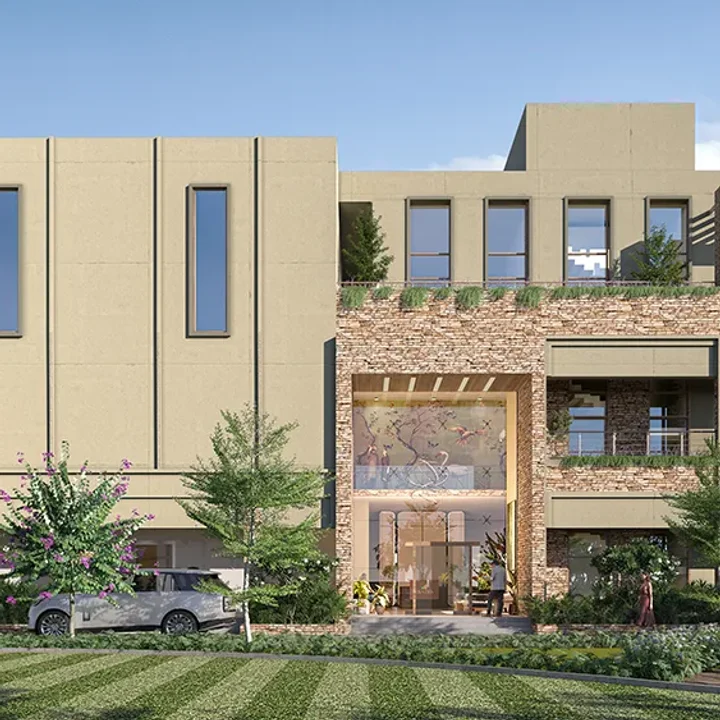 Sattva Ekatra clubhouse facade with a stone-clad entrance
